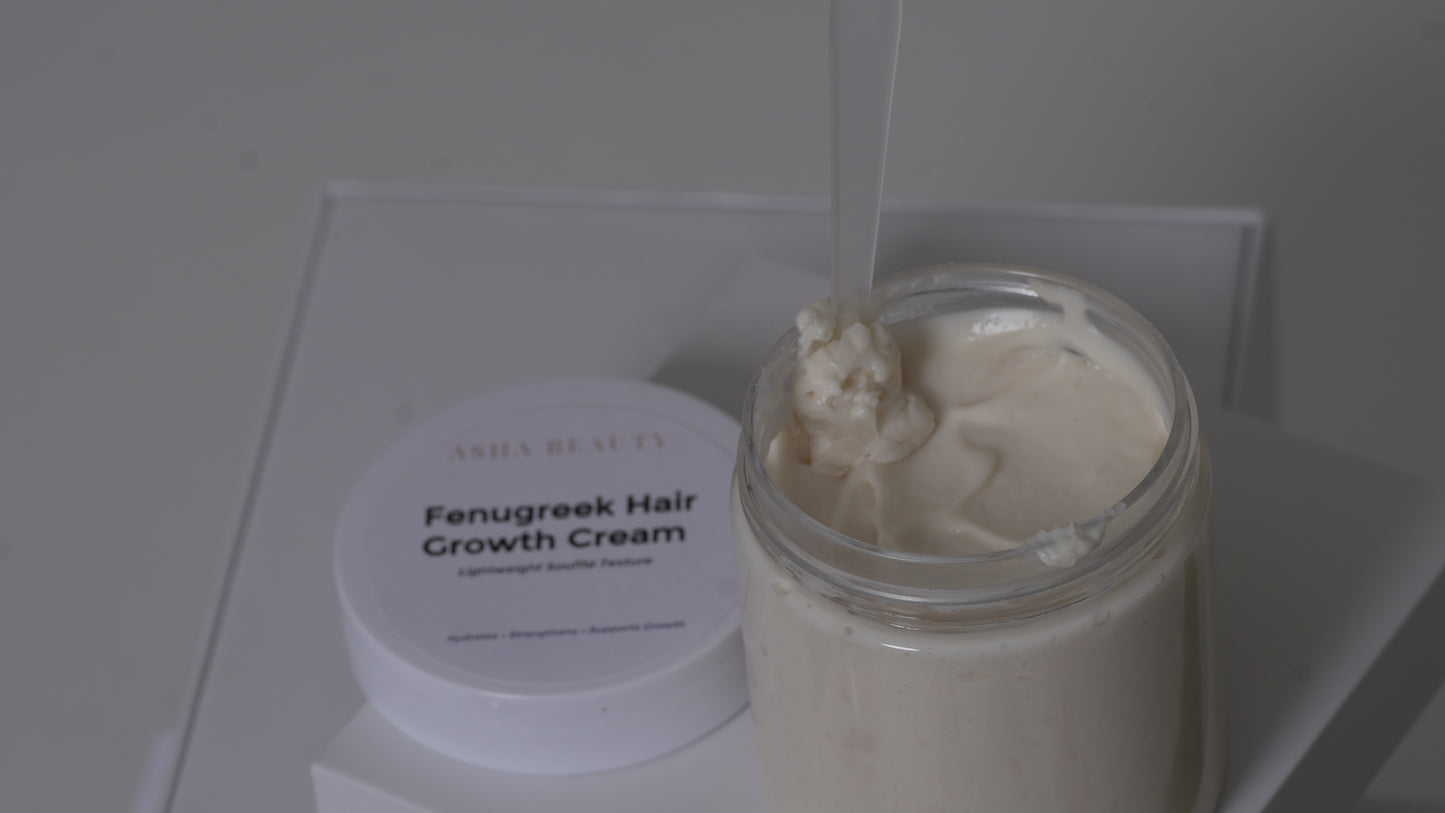 A jar of Asha Belle Beauty Fenugreek Hair Growth Cream with its white lid beside it, showing a thick off-white cream inside a clear glass jar.